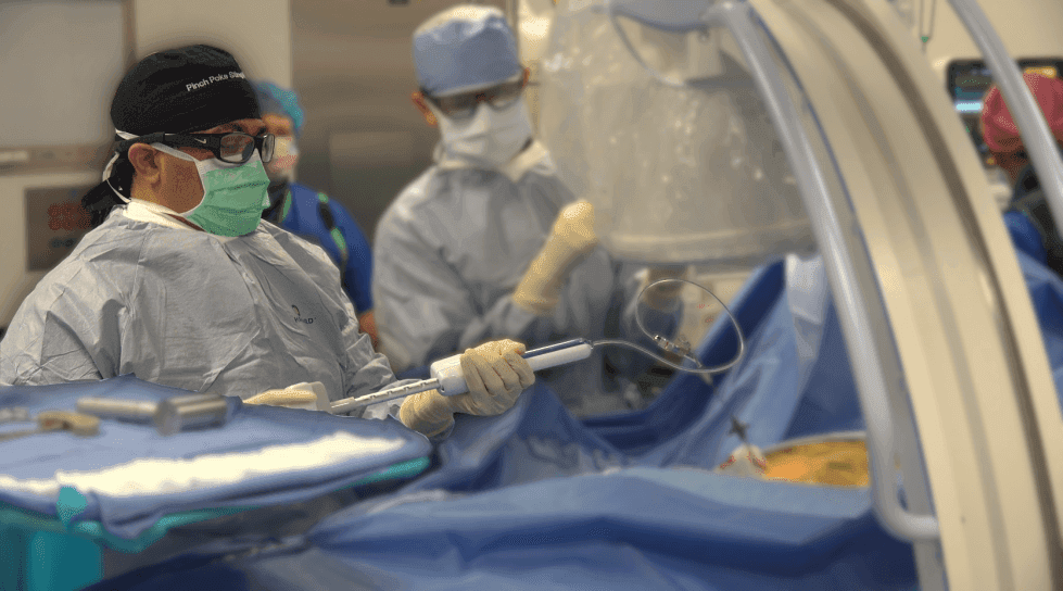 Medical team engaged in a surgical operation in a hospital setting.
