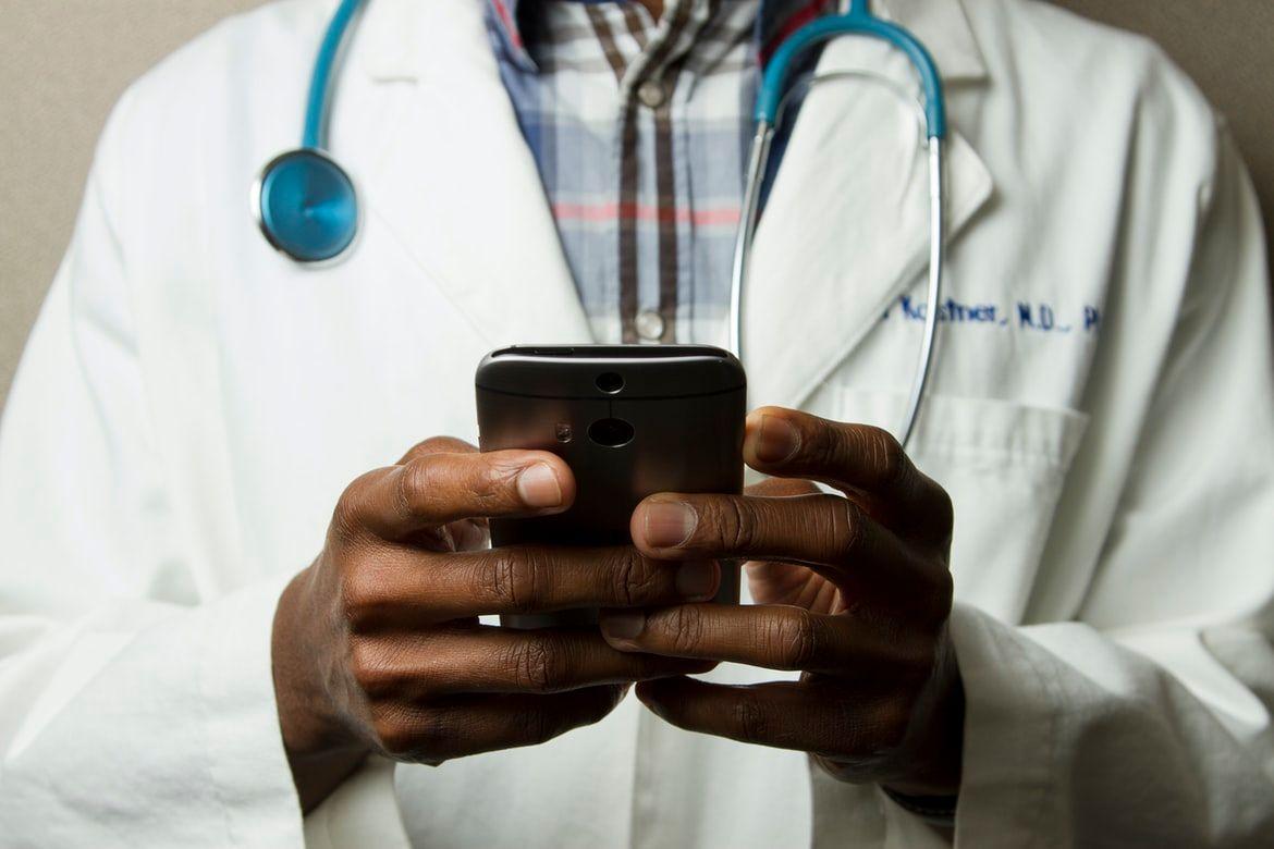 A person searching for amazon care on his mobile device.