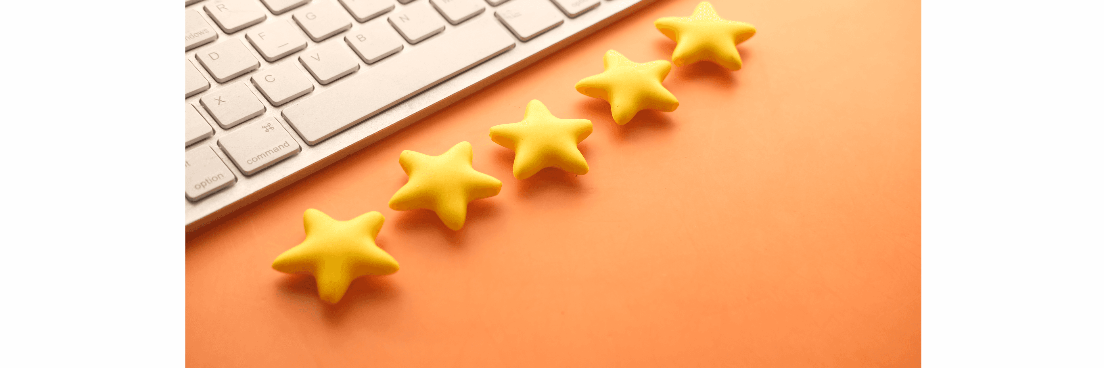 A picture of laptop with 5 stars lying next to it in a straight line mostly trying to portray the meaning of reviews.