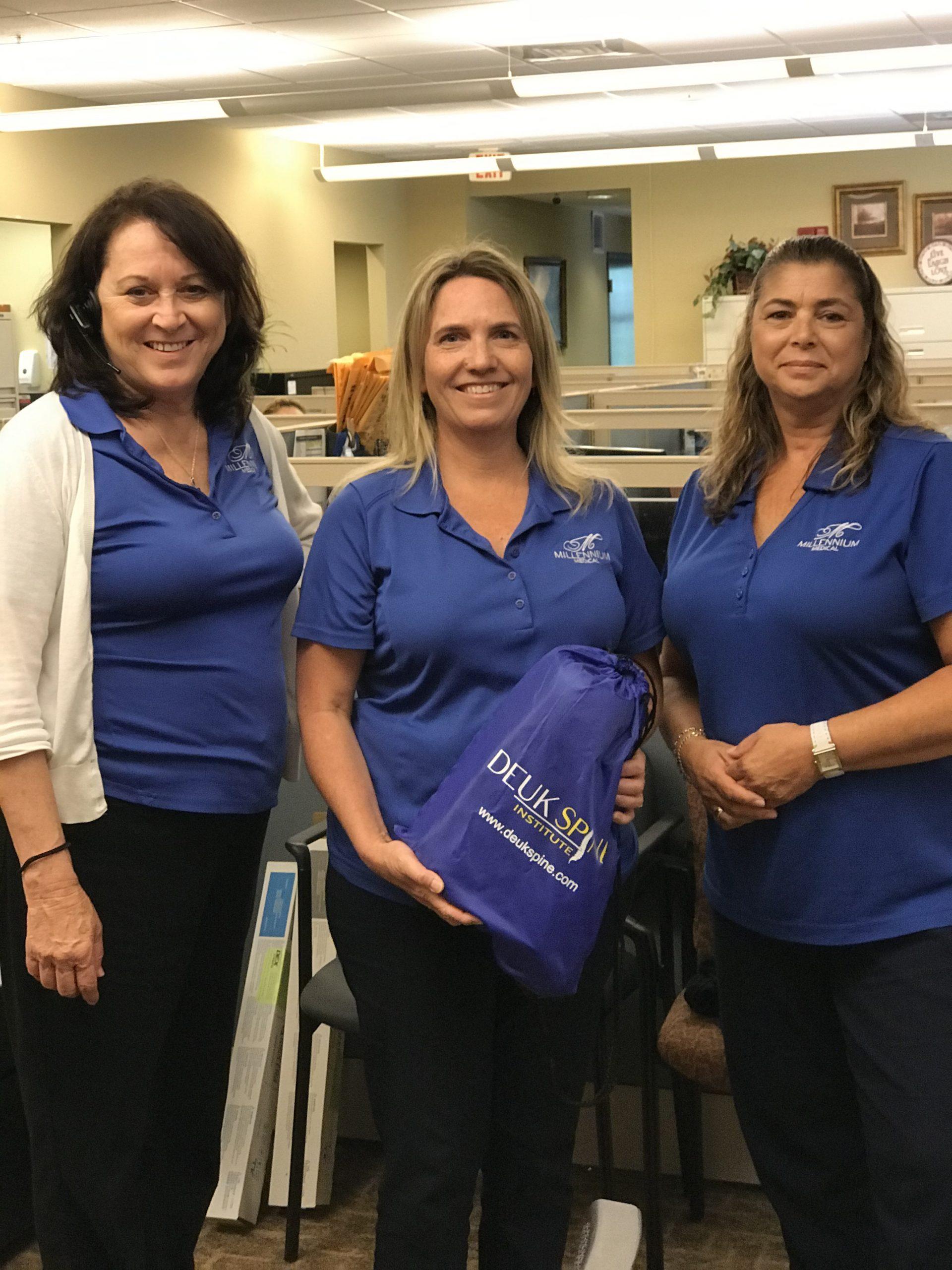 A picture of an employee being honored with employee of the month.