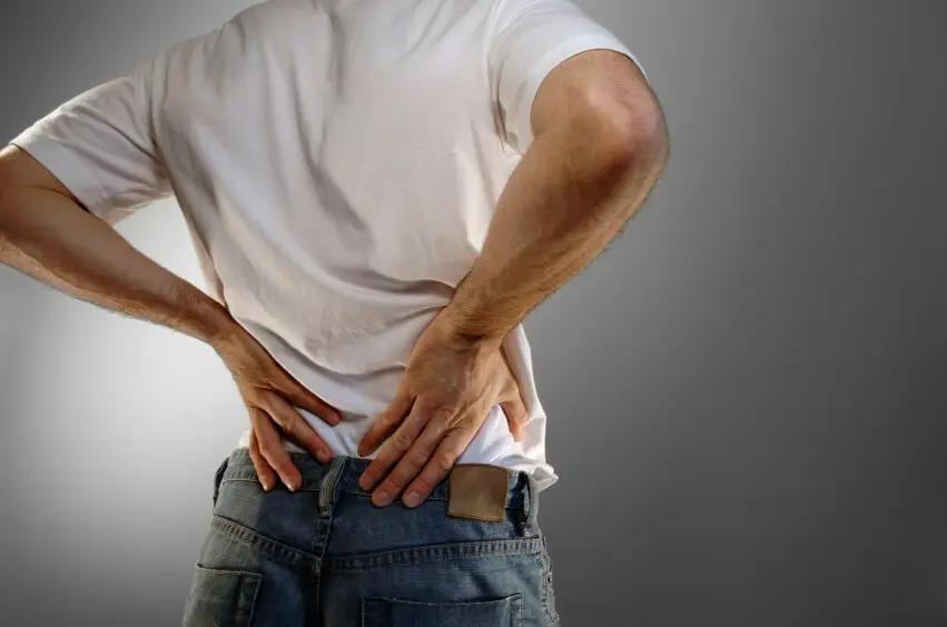 A picture of a man with lower back pain.