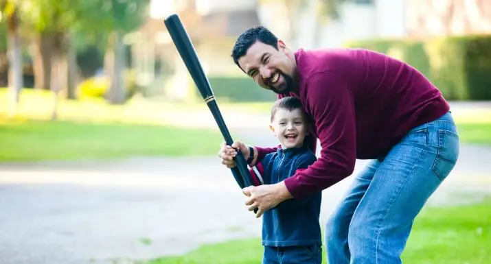 Man and Son with Baseball Bat