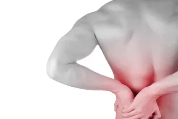 A man holding his lower back in pain, isolated on a white background.