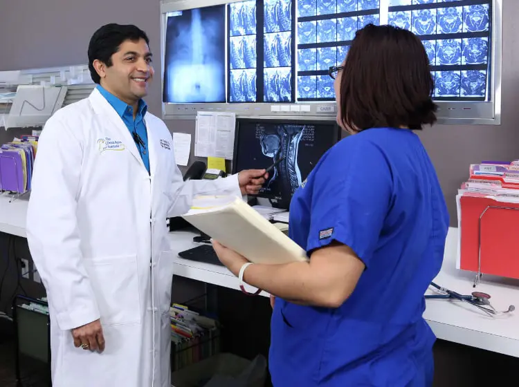 Dr. Patel explaining the MRI to the nurse.