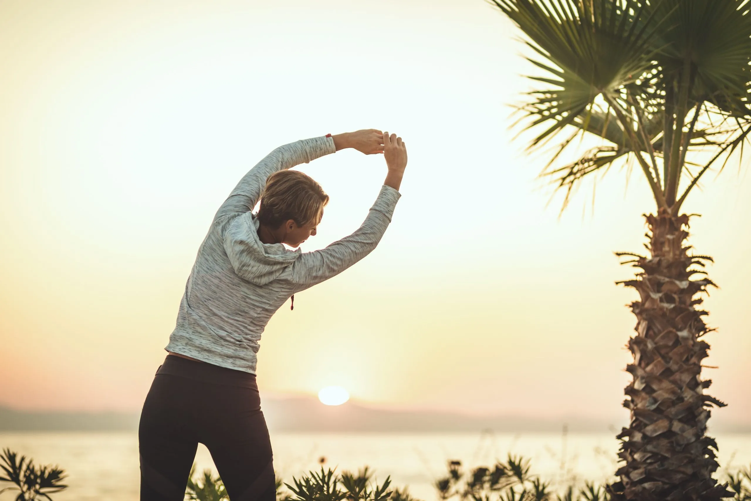 Woman practicing yoga with natural spine flexion