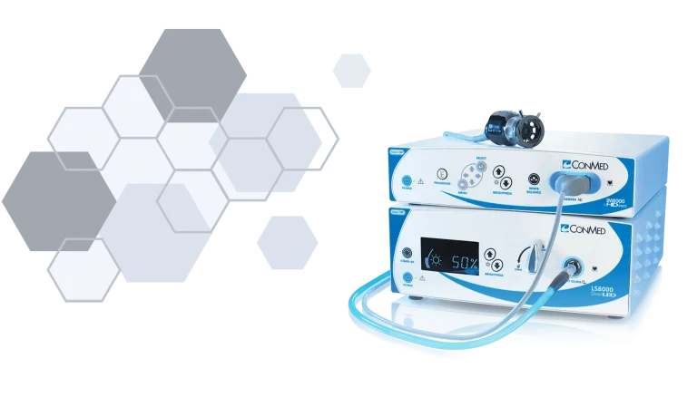 Medical equipment with digital controls next to hexagonal design elements.