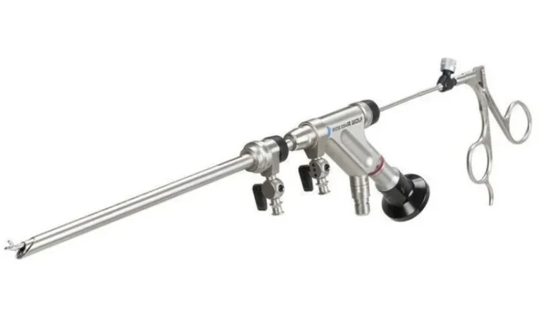 A surgical endoscope with silver metal components and control grips.