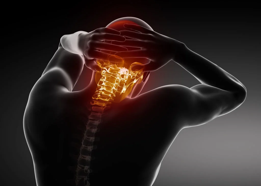 A person holds their head with highlighted neck vertebrae in orange.