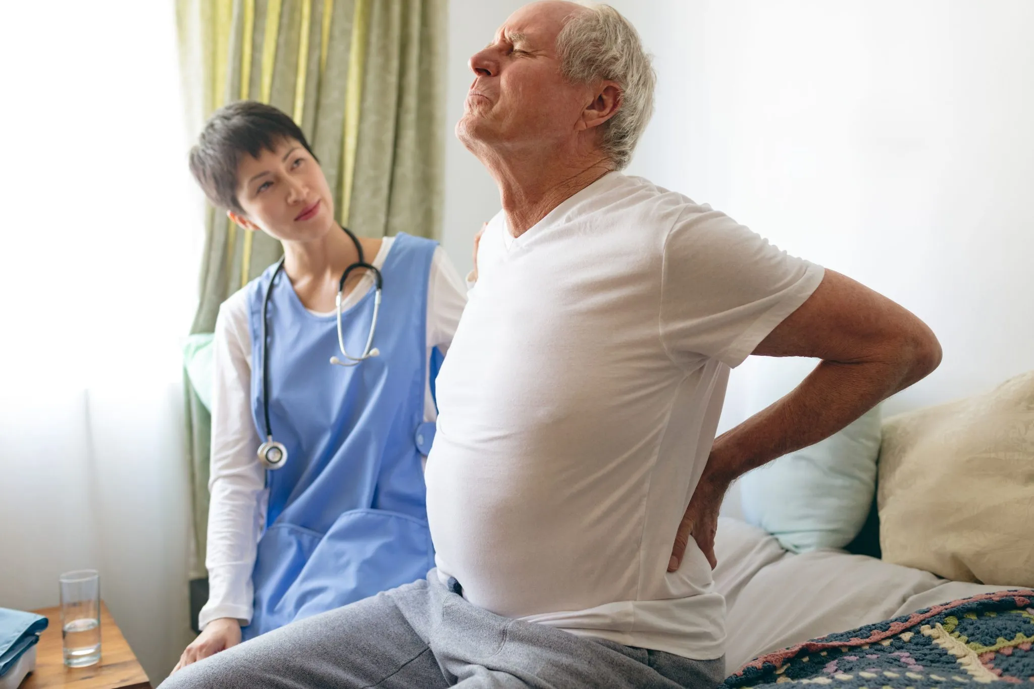 Doctor examining post op spine surgery patient