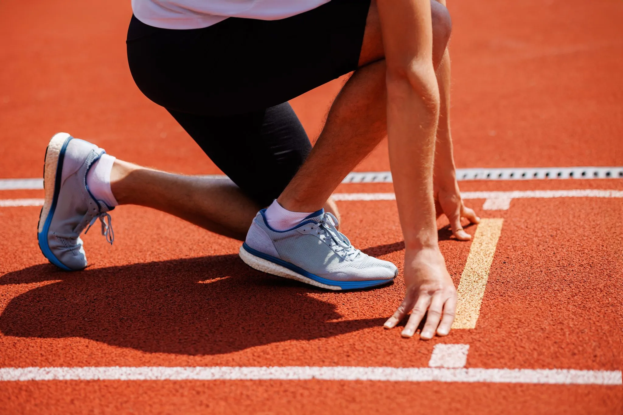 A picture of an athlete all set on the running track is used to portray how deuk spine institute emerged in 2004.