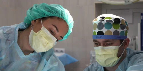 A picture of surgeons in an operating room.